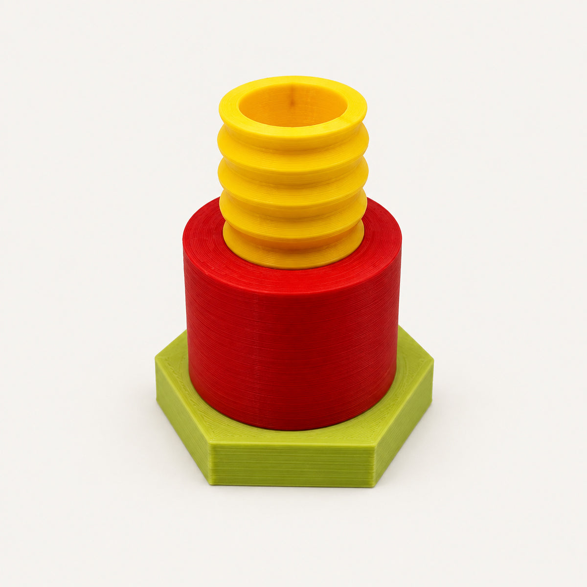 Modularer 3D-Kerzenständer Citrus Twist mit gelber gerippter Kerzenaufnahme, rotem Zylinder und limettengrünem Sechskantfuß – ohne Kerze, freigestellt auf neutralem Hintergrund.